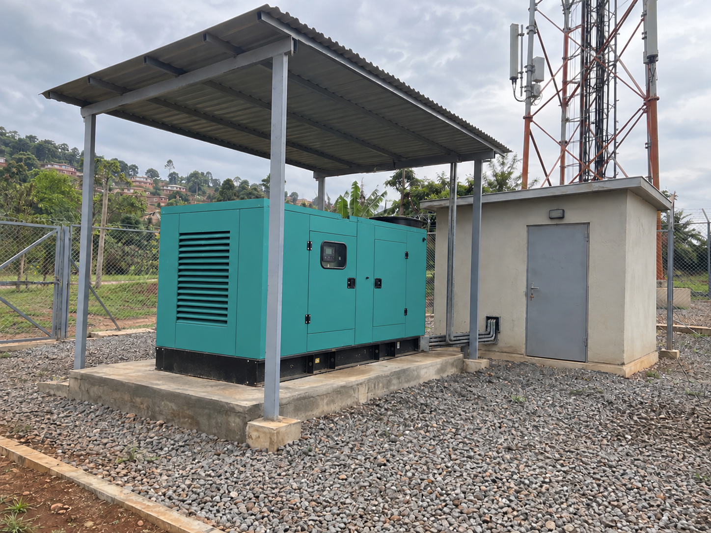 A diesel backup generator under a ventilated canopy at a telecom tower compound near Kampala, Uganda — illustrative scene